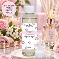 Yara reed diffuser refill by Twink Candle Company, a 100ml bottle among soft roses and blossom