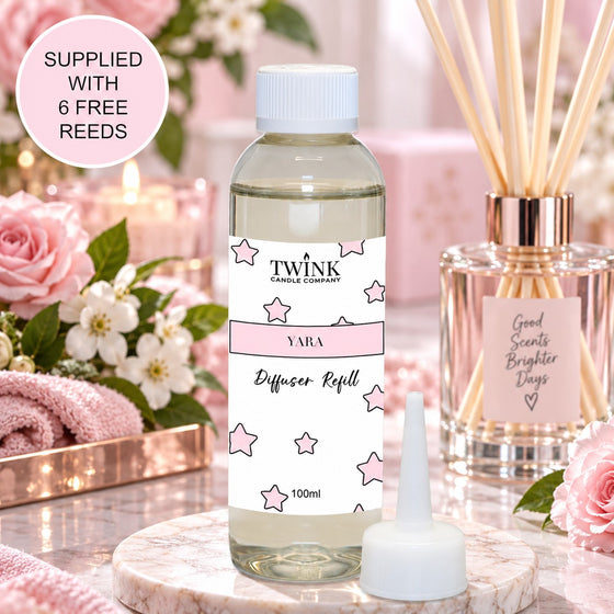 Yara reed diffuser refill by Twink Candle Company, a 100ml bottle among soft roses and blossom