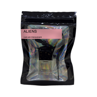 Aliens car air freshener by Twink Candle Company, hanging car vent clip diffuser on a white background