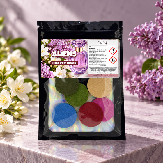 Aliens scented hoover discs by Twink Candle Company, pack of 8 styled in a home setting