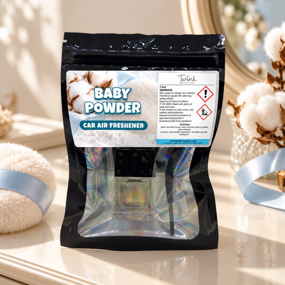Baby Powder car air freshener by Twink Candle Company, packet styled in a home setting