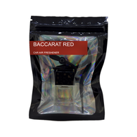 Baccarat Red car air freshener by Twink Candle Company, hanging car vent clip diffuser on a white background