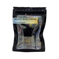 Beach Bum Cream car air freshener by Twink Candle Company, hanging car vent clip diffuser on a white background