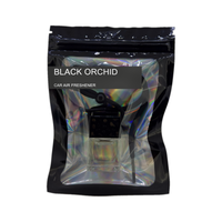 Black Orchid car air freshener by Twink Candle Company, hanging car vent clip diffuser on a white background