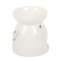 Side view of the Butterflies Appear white ceramic wax and oil burner by Twink Candle Company