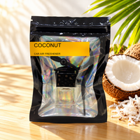Coconut car air freshener by Twink Candle Company, hanging vent diffuser styled in a home setting