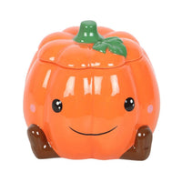 Cute smiling pumpkin wax/oil burner by Twink Candle Company — an orange ceramic pumpkin with a smiling face and star cut-outs