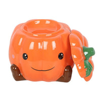Cute smiling pumpkin wax/oil burner by Twink Candle Company, lid removed
