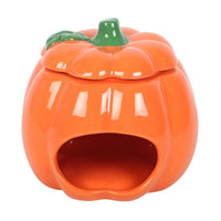 Cute smiling pumpkin wax/oil burner by Twink Candle Company, showing the bowl inside