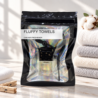 Fluffy Towels car air freshener by Twink Candle Company, hanging vent diffuser styled in a home setting