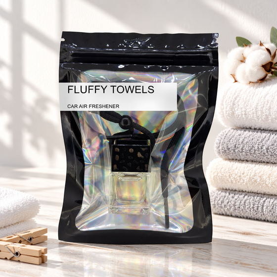Fluffy Towels car air freshener by Twink Candle Company, hanging vent diffuser styled in a home setting