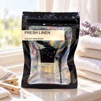 Fresh Linen car air freshener by Twink Candle Company, hanging vent diffuser styled in a home setting