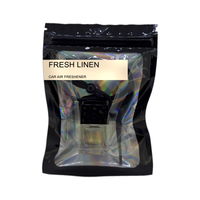 Fresh Linen car air freshener by Twink Candle Company, hanging car vent clip diffuser on a white background