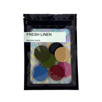 Pack of 8 Fresh Linen scented hoover discs in its sealed black foil packet on a plain white background