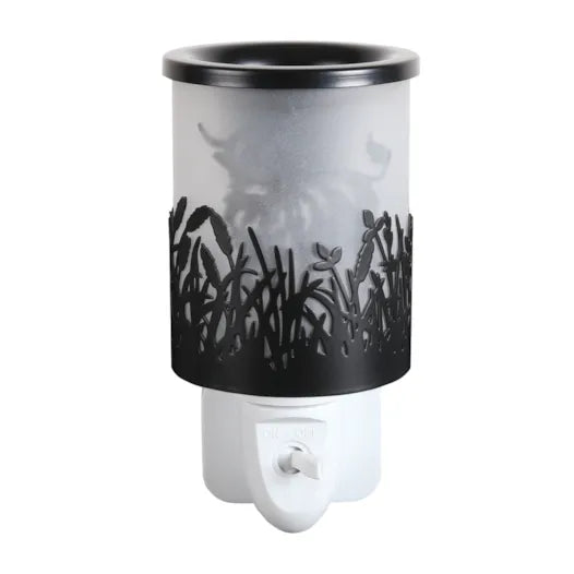Highland Cow Black Shadow plug-in wax melt burner, unlit, showing the black cut-out ceramic design