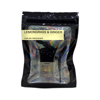 Lemongrass & Ginger car air freshener by Twink Candle Company, hanging car vent clip diffuser on a white background
