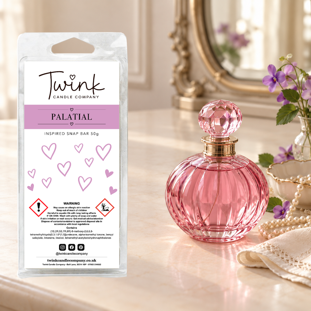 Palatial inspired soy wax melt snap bar by Twink Candle Company, standing on a cream dressing table beside a pink glass perfume bottle