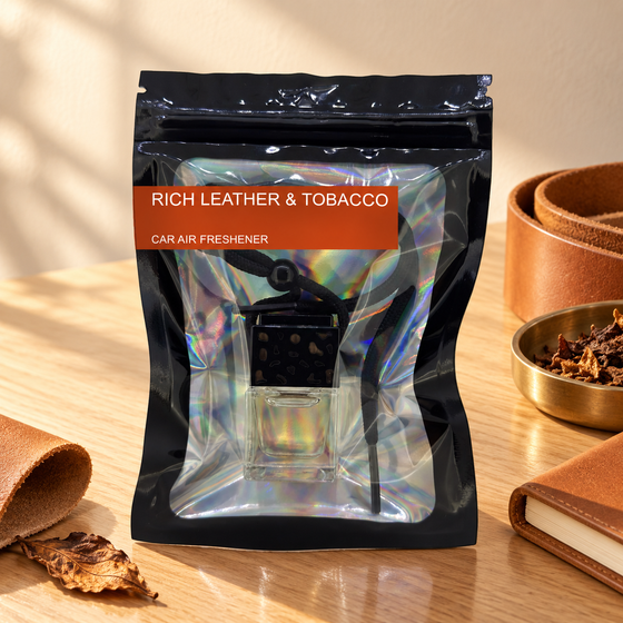 Rich Leather & Tobacco car air freshener by Twink Candle Company, hanging vent diffuser styled in a home setting