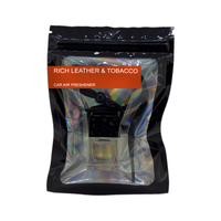 Rich Leather & Tobacco car air freshener by Twink Candle Company, hanging car vent clip diffuser on a white background