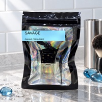 Savage car air freshener by Twink Candle Company, hanging vent diffuser styled in a home setting