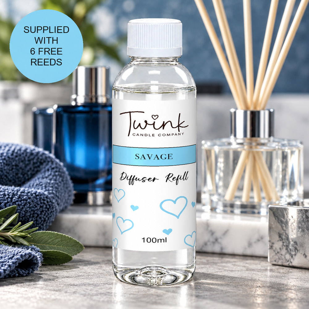 Savage reed diffuser refill by Twink Candle Company, a 100ml bottle on a concrete slab with a deep blue aftershave bottle behind