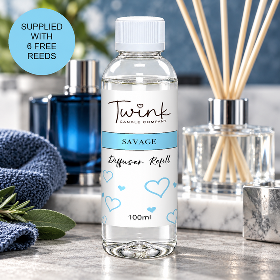 Savage reed diffuser refill by Twink Candle Company, a 100ml bottle on a concrete slab with a deep blue aftershave bottle behind
