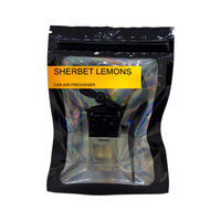 Sherbet Lemons car air freshener by Twink Candle Company, hanging car vent clip diffuser on a white background