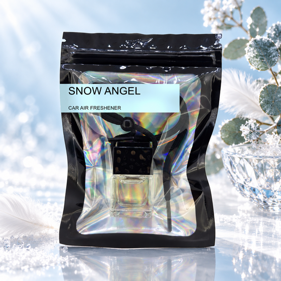 Snow Angel car air freshener by Twink Candle Company, hanging vent diffuser styled in a home setting