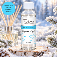 Snow Angel reed diffuser refill by Twink Candle Company, a 100ml bottle on a birch log slice in a frosted winter forest