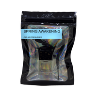 Spring Awakening car air freshener by Twink Candle Company, hanging car vent clip diffuser on a white background