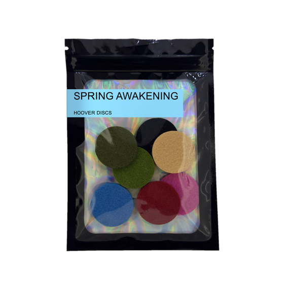 Pack of 8 Spring Awakening scented hoover discs in its sealed black foil packet on a plain white background
