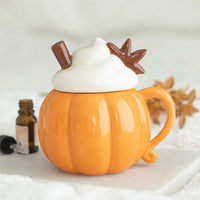 Whipped cream pumpkin wax/oil burner by Twink Candle Company, styled with a bottle of fragrance oil