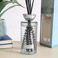Woodbridge Lotus & Jasmine 1000ml reed diffuser styled in a room