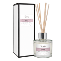 Yara reed diffuser by Twink Candle Company, a 100ml glass bottle with reeds beside its white gift box on a plain white background